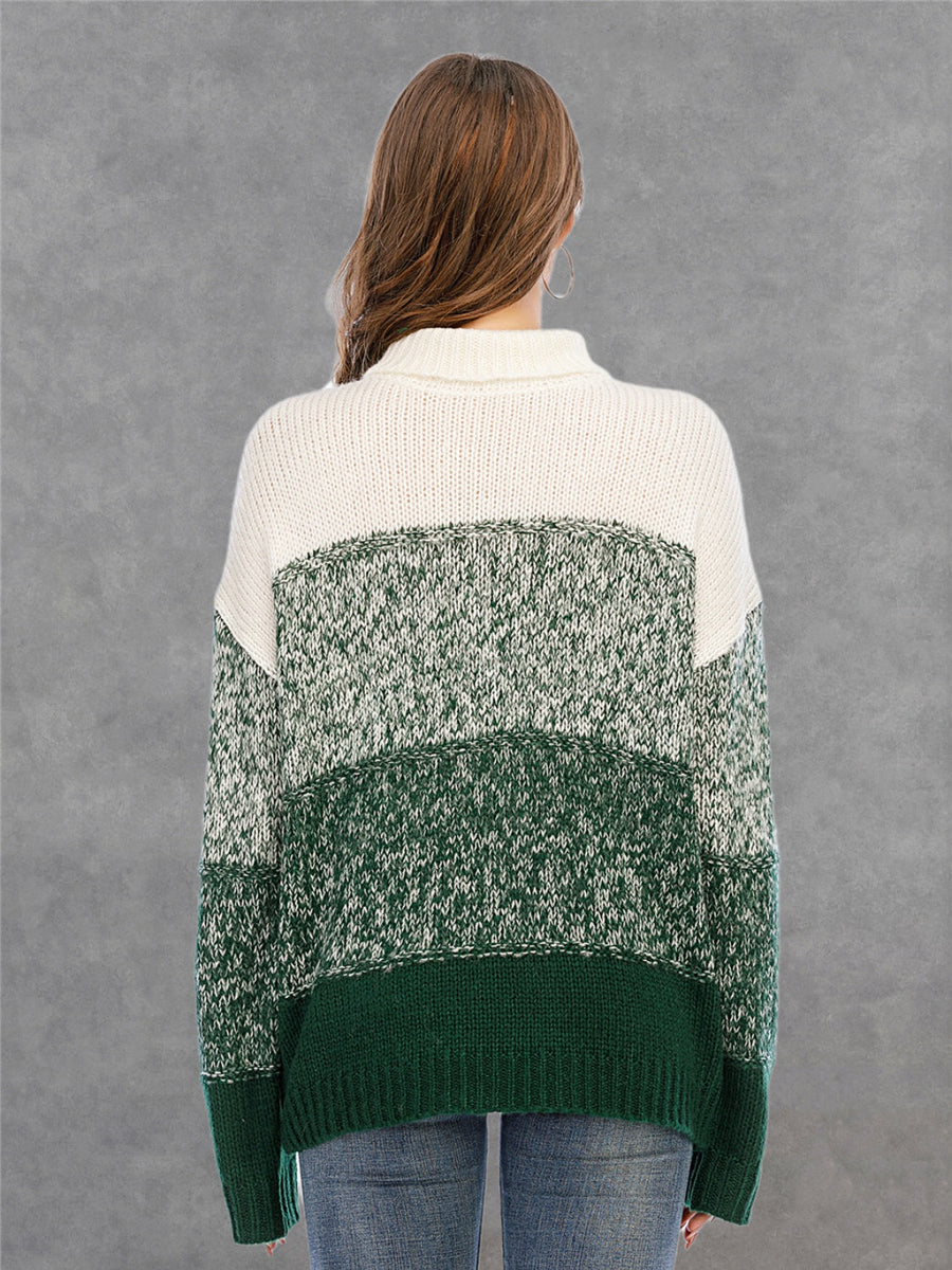Colorblock turtleneck sweater in green and white acrylic with defined panels.