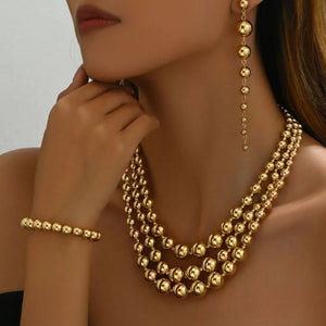 gold jewelry set with beaded and not applicable
