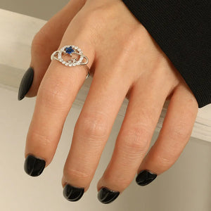 Silver ring with blue zircon and star details, sterling silver band