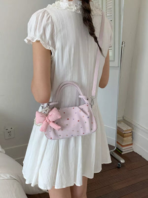 crossbody bag in Pink with bow charm and mini