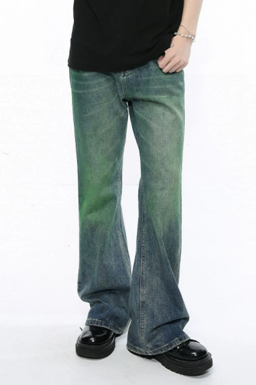 Ombre flare denim trousers in medium wash with green gradient detail, cotton composition, flared leg.