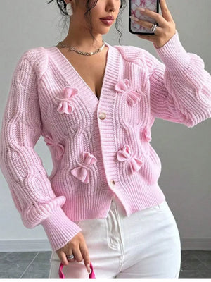 light pink cardigan with cable knit and v-neck