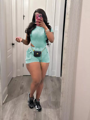 Sky blue ribbed crop top and pocket shorts set with a chain belt.