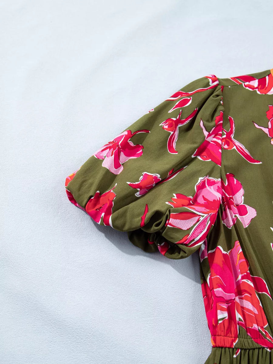 Print split neck dress with puffed sleeves and floral pattern in green and pink.