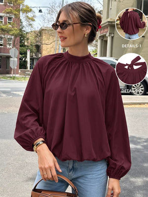 blouse in burgundy featuring tied back and relaxed fit