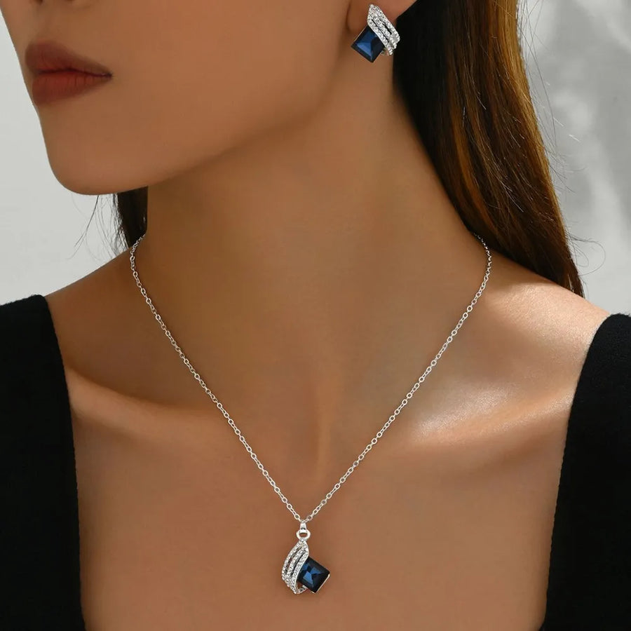 sapphire blue jewelry set featuring crystal embellishment and geometric