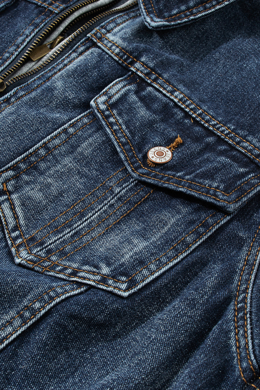 Dark blue denim jacket with zipper and buttoned chest pocket detail