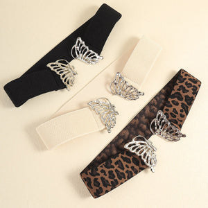 Elastic waist belts in black, light yellow, and leopard print with butterfly buckles