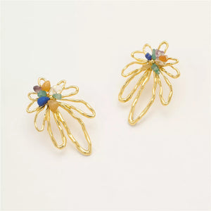 earrings in blue with floral and natural stone