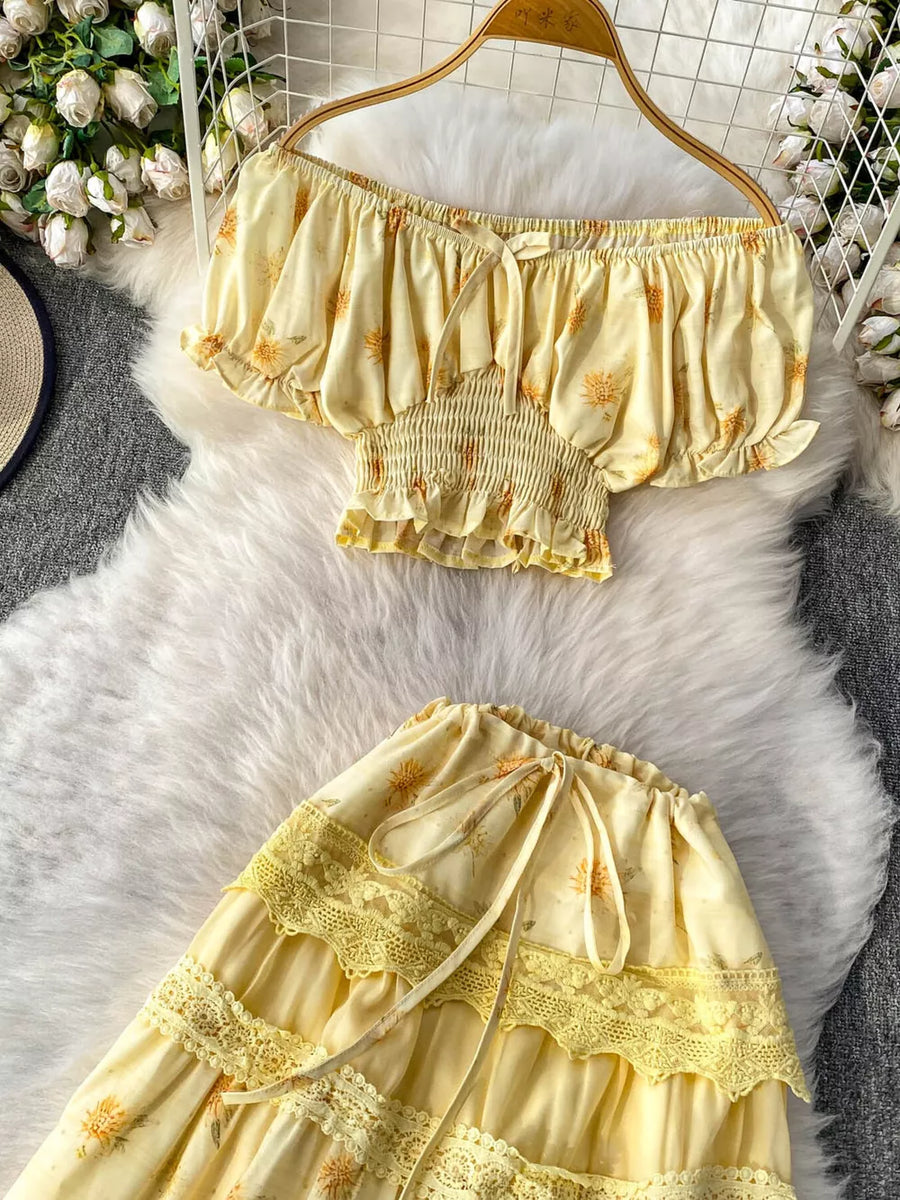 Yellow floral ruffled off-shoulder crop top and tiered lace skirt set with tie details.