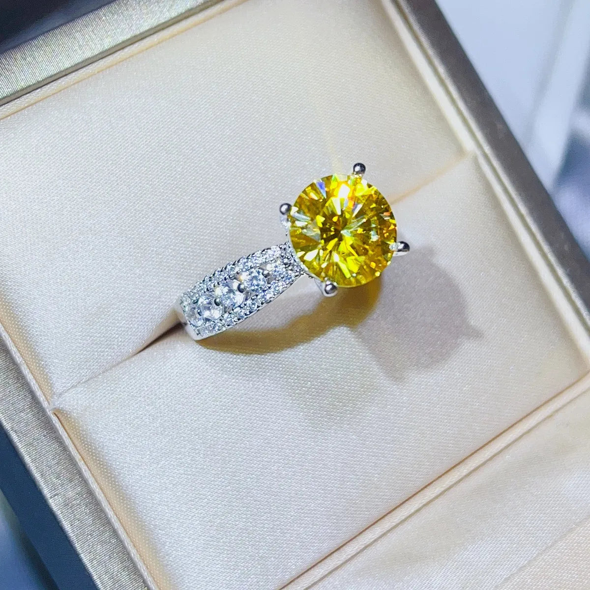 Radiant canary moissanite pavé band ring with a large yellow center stone.