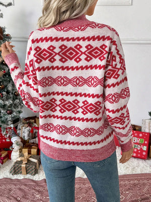 Red and white patterned long-sleeve sweater with a round neck.