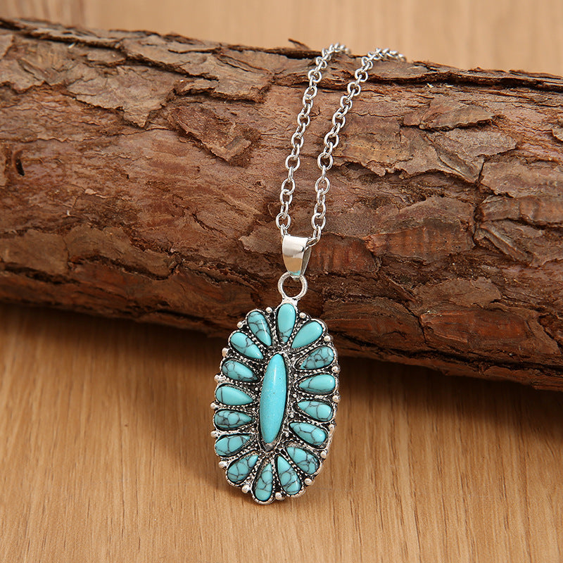 Southwestern turquoise cluster necklace with silver chain, teal stones.