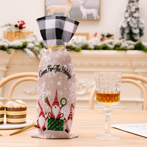 Festive gnome plaid bottle cover with "Gnome For The Holidays" text and snowflakes.