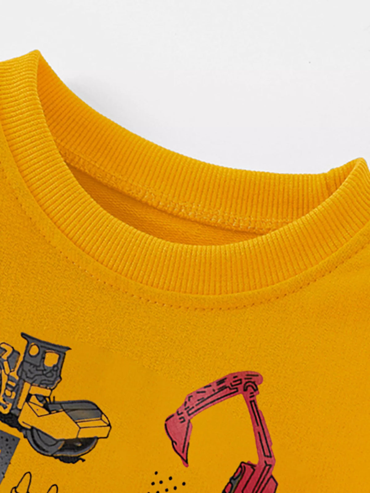 Mustard yellow baby sweatshirt with cartoon construction vehicles.