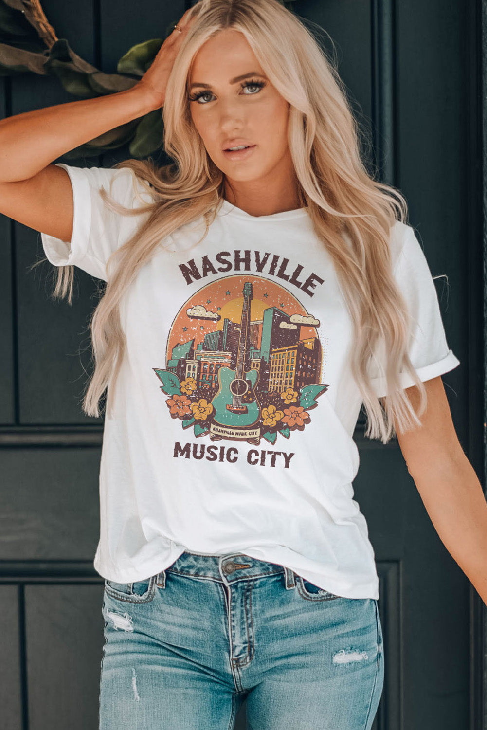 White graphic t-shirt with Nashville Music City skyline and guitar design