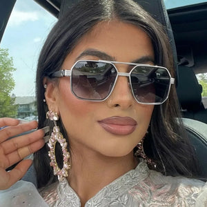 sunglasses in silver featuring UV protection and geometric fit