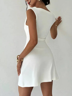 White sweetheart off-shoulder mini dress with draped detail and flared skirt.
