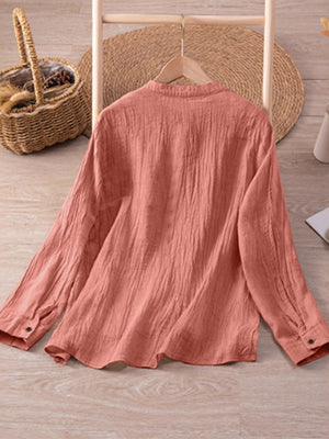 Coral button-down shirt with hip-length and button-front