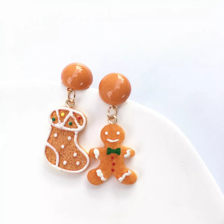 Gingerbread man and stocking holiday earrings with orange studs.