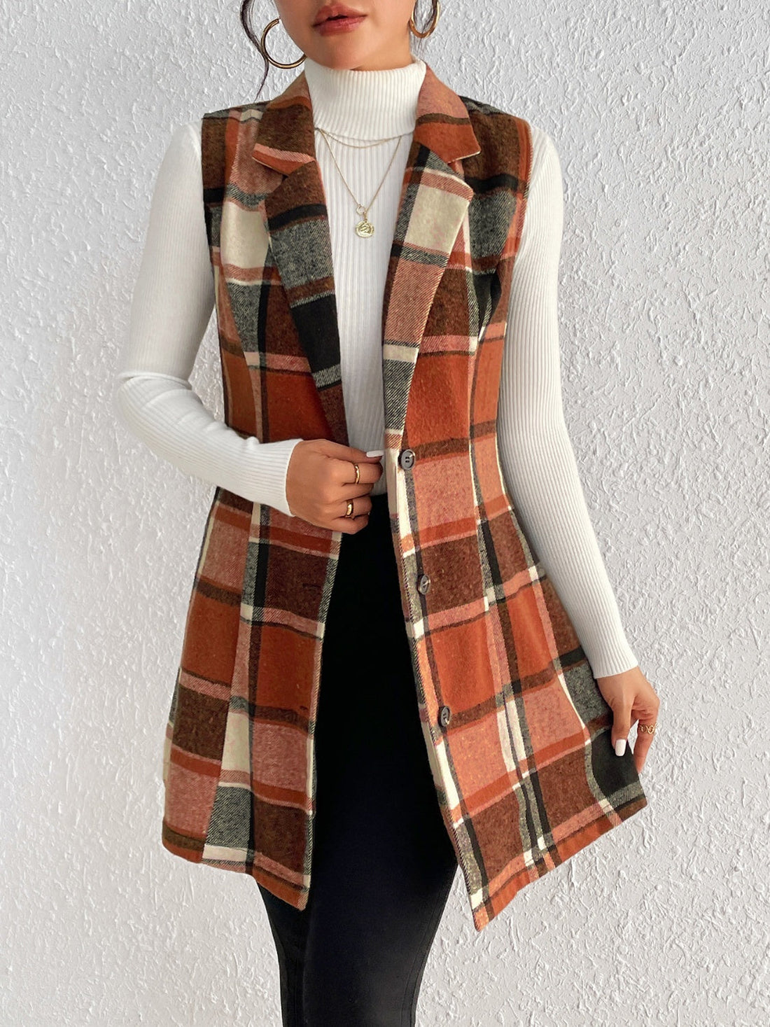 Tailored plaid sleeveless blazer dress in caramel with button front and notched lapels.