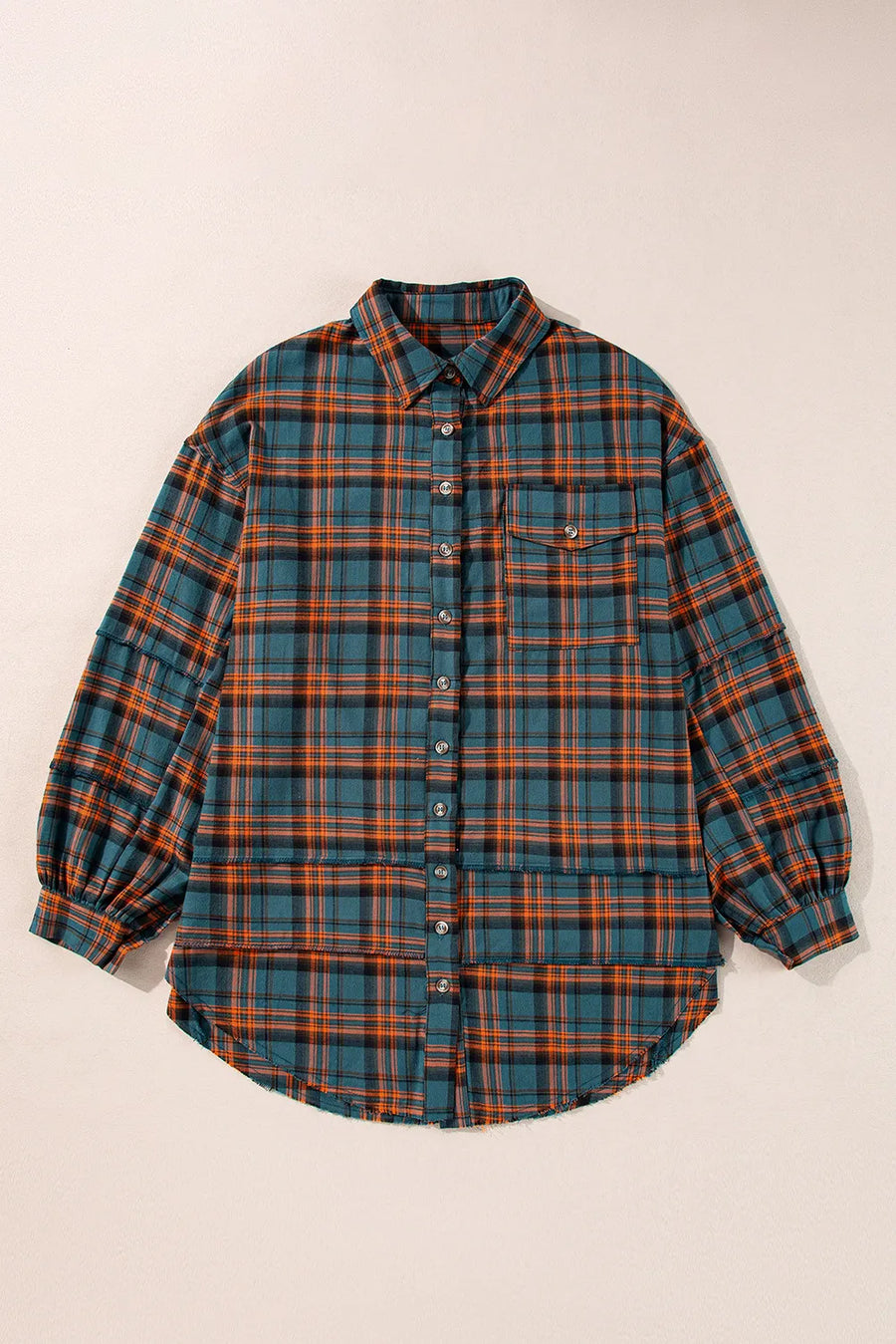 Oversized plaid overshirt in French Blue with layered hem and button front.