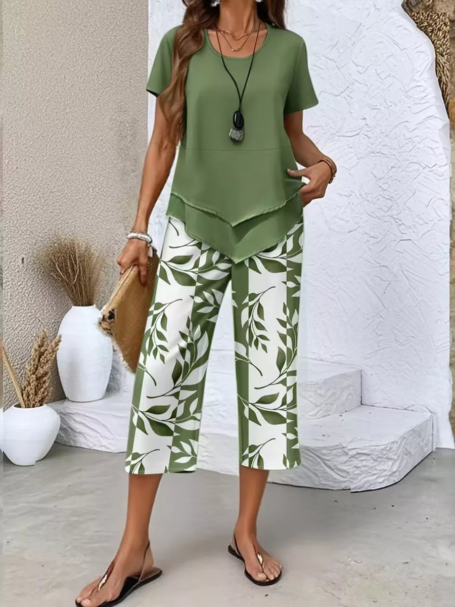 Green layered short sleeve top with leaf print capri pants.