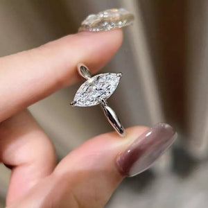 Marquise cut diamond engagement ring in silver with a solitaire setting.