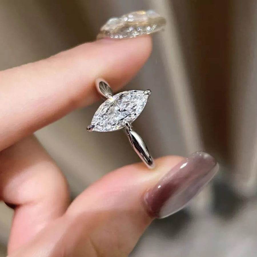 Marquise cut diamond engagement ring in silver with a solitaire setting.