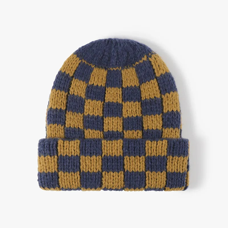 Checkerboard knit beanie in navy and mustard yellow, with a cuffed brim.