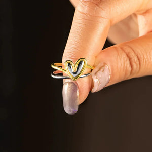 Two-tone gold heart outline ring with double band detail.