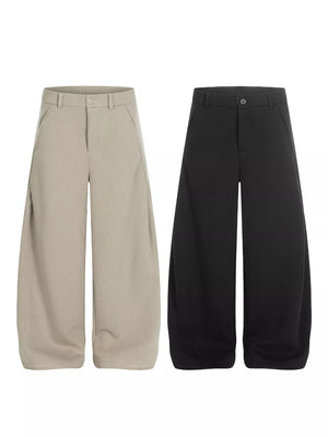 Men's relaxed fit sweatpants in black and apricot with pockets.