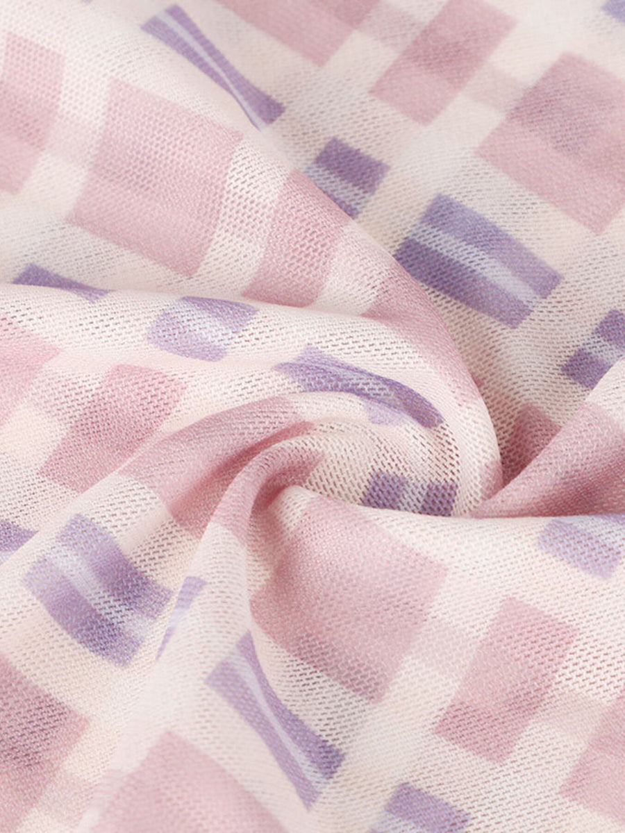 Ruched tied maxi dress in 100% polyester with a pink and purple checkered pattern.
