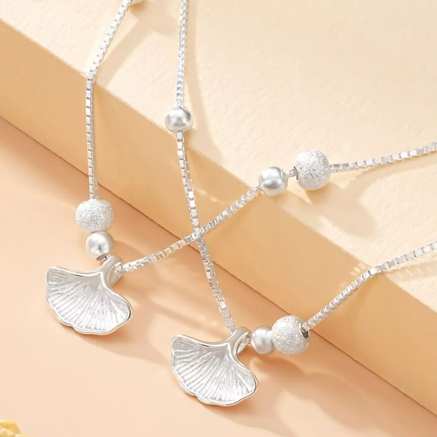 Silver bracelet featuring double layer and botanical