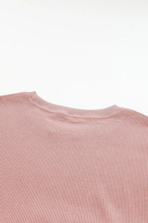 Dusty Pink ribbed crewneck sweatshirt with a subtle heart outline detail.