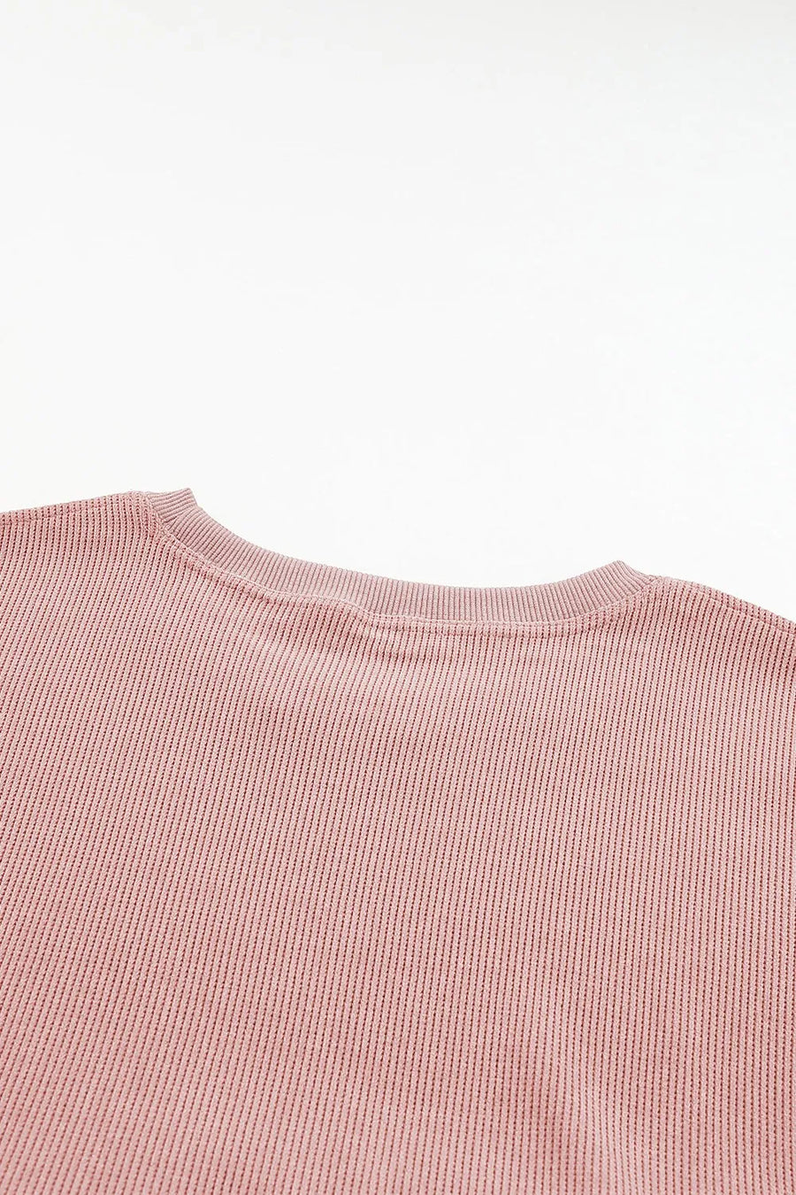 Dusty Pink ribbed crewneck sweatshirt with a subtle heart outline detail.