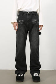 Carpenter jeans in washed black denim with relaxed fit and utility pockets.