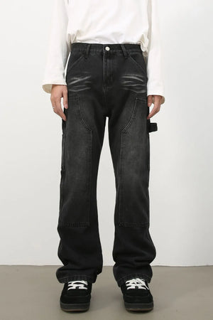 Carpenter jeans in washed black denim with relaxed fit and utility pockets.