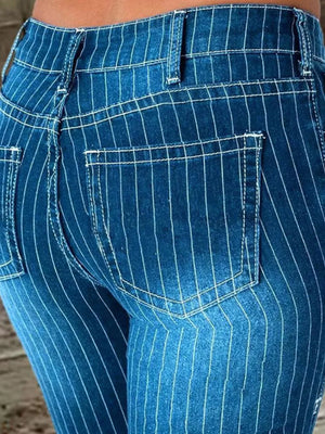 Blue denim maternity flare jeans with white pinstripes and button fly detail.