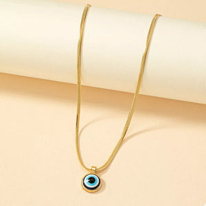 Golden necklace featuring gold-plated and evil eye motif