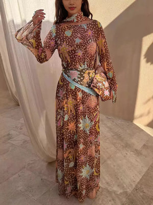 Brown celestial print maxi dress with long bell sleeves and a matching scarf.