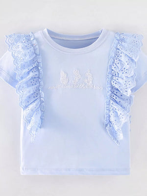 Light blue cotton t-shirt with eyelet ruffles and floral embroidery.