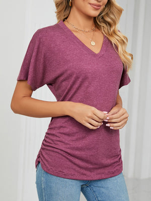 Burgundy relaxed V-neck t-shirt with short dolman sleeves and side ruching detail.