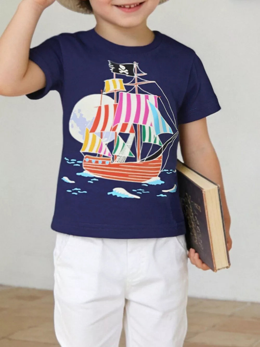 Toddler navy cotton crew neck t-shirt with a colorful pirate ship graphic and moon.