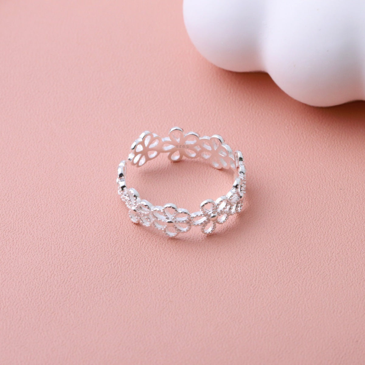 Silver ring featuring adjustable and floral