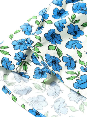 Cotton blouse with blue floral print and ruffle sleeves.