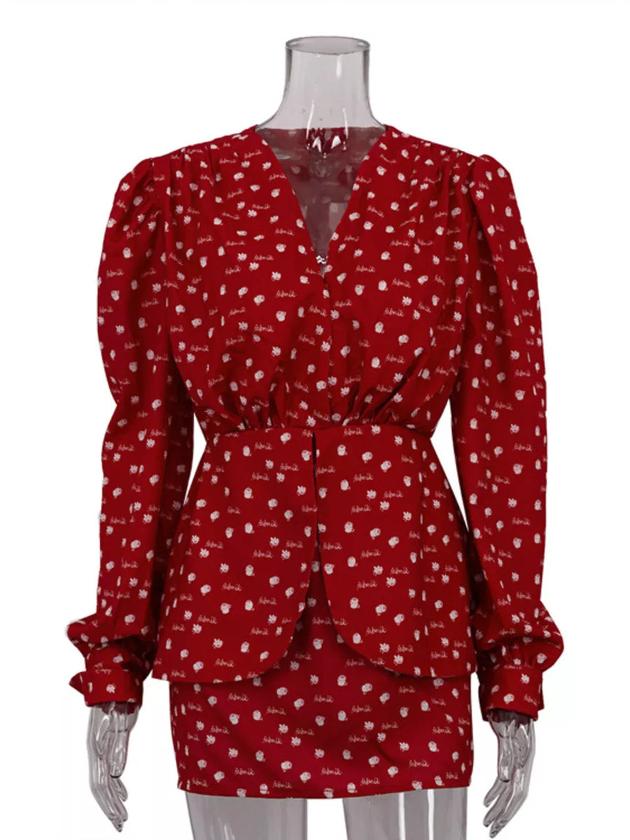Red floral print blouse with V-neck, puff sleeves, and peplum hem
