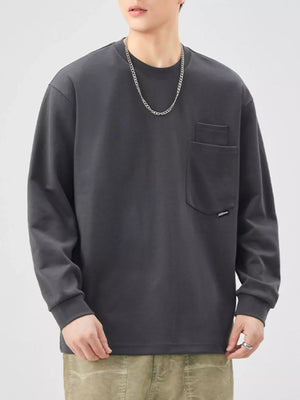 Dark gray casual oversized long-sleeve sweatshirt with a chest pocket and crew neck.