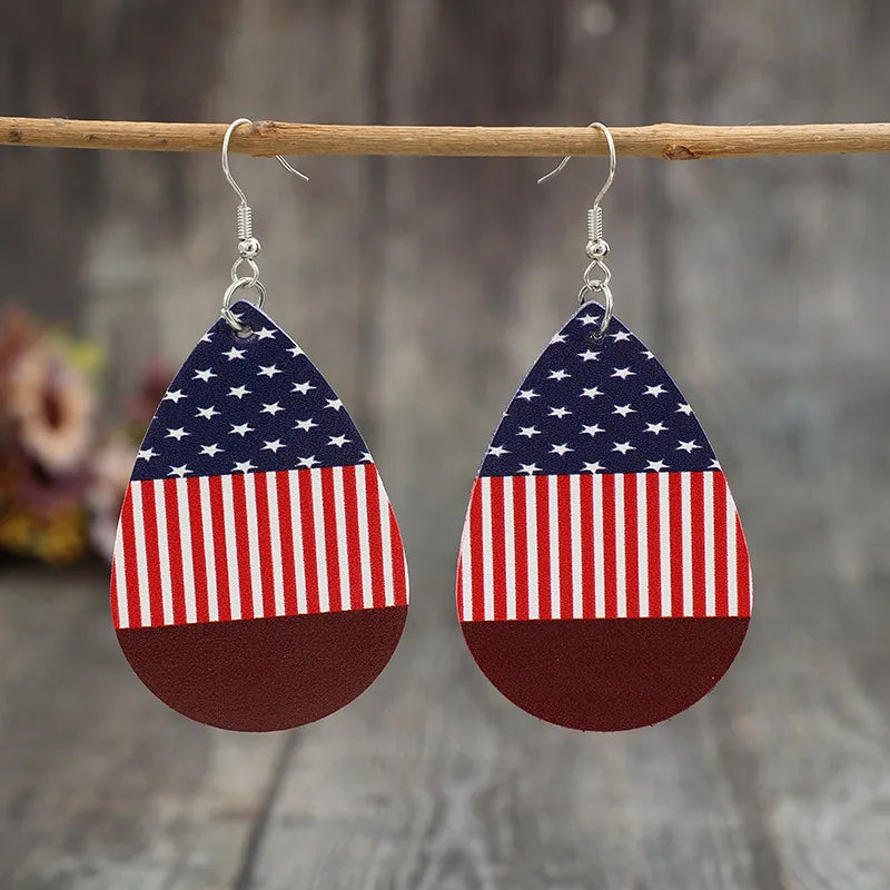 Patriotic faux leather teardrop earrings with American flag print in deep red.
