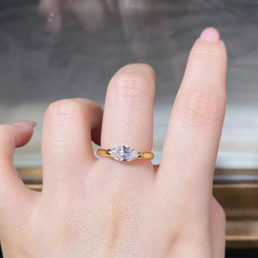 ring in gold featuring marquise-cut diamond and fitted fit